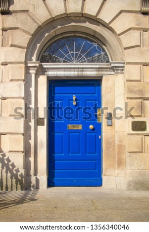 Georgian blue door entrance on a sunny day Royalty-Free Stock Photo #1356340046
