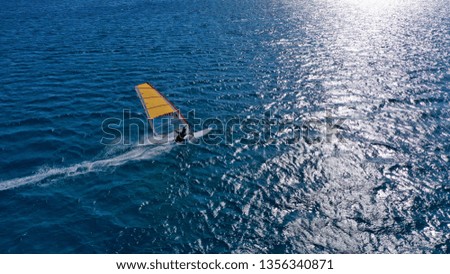 Aerial drone photo of Wind surfer practising in Mediterranean deep blue sea beach 
