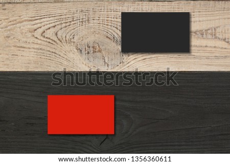 Blank business cards on the Black wooden table. Template for ID. Top view