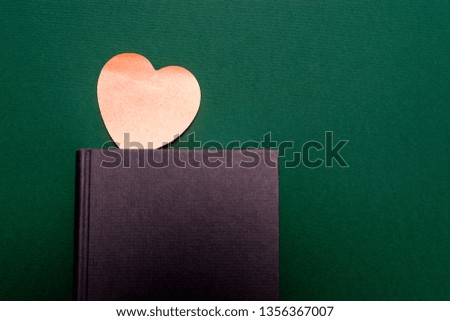 Black book with heart shaped sticker