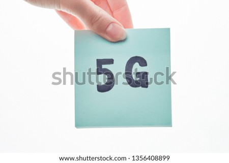 5g inscription on a paper sticker in the girl's hand