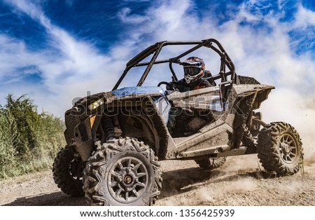 ATV adventure. Buggy extreme ride on dirt track. UTV Royalty-Free Stock Photo #1356425939