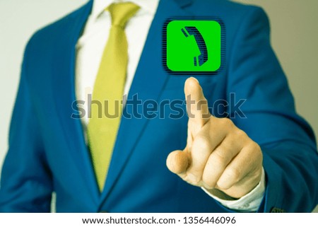 Businessman pressing phone button, visual screen. Communication concept