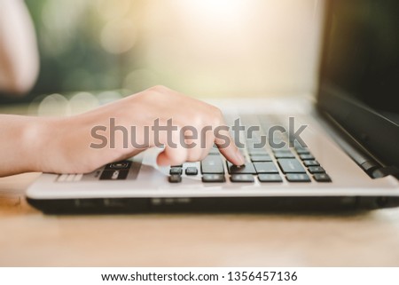 Woman office worker is pressing enter - Image