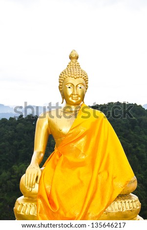 golden buddha image on top of the mountain