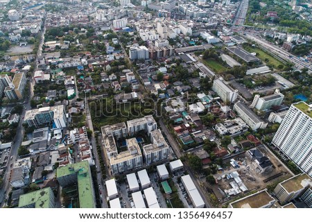 Modern city home and office block building with road aerial view