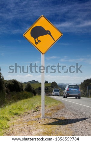 Kiwi bird icon on road sign, rural New Zealand