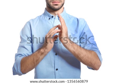 Man showing JESUS in sign language on white background, closeup