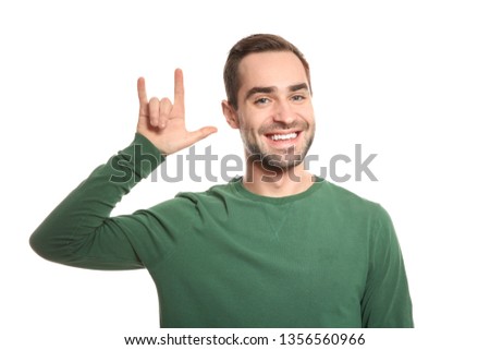 Man showing I LOVE YOU gesture in sign language on white background
