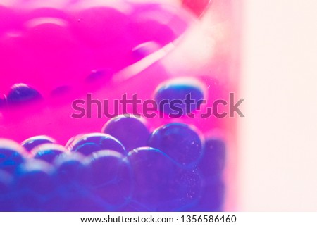 Macro picture of purple droplets falling in the lava bubblier 