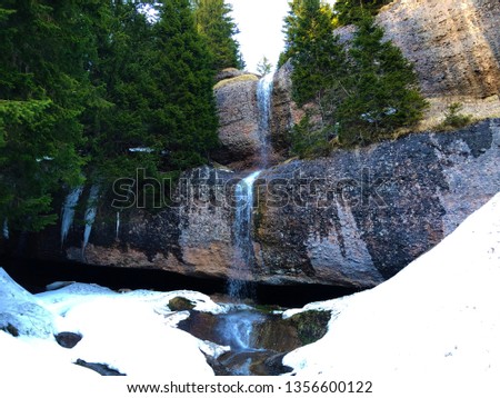 Spring waterfall under the peak of Rigi Kulm and the tributary of Rigiaa stream - Canton of Schwyz, Switzerland