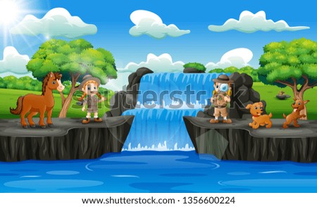 Happy zookeeper boy and girl in waterfall scene