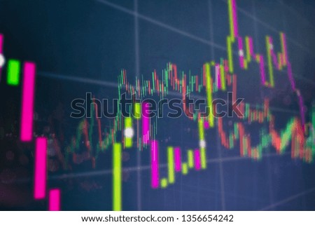 financial trading graphs on monitor. Background with currency bars and candles