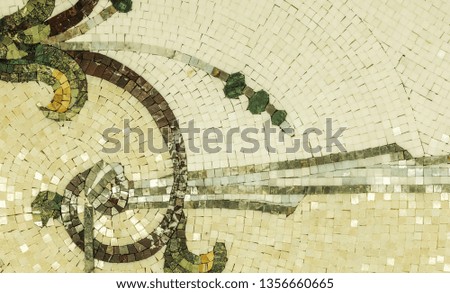 Marble mosaic background. Panel of marble mosaics. Selective focus. A multi-colored picture created by pieces of multi-colored marble
