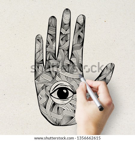 Esoteric mandala hand with eye drawing on light texture. Oriental ornament and hinduism concept 