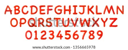 Creative alphabet and numbers made of tomato sauce on white background