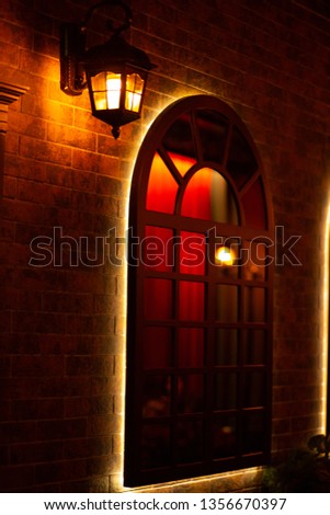 Wall light near window Royalty-Free Stock Photo #1356670397