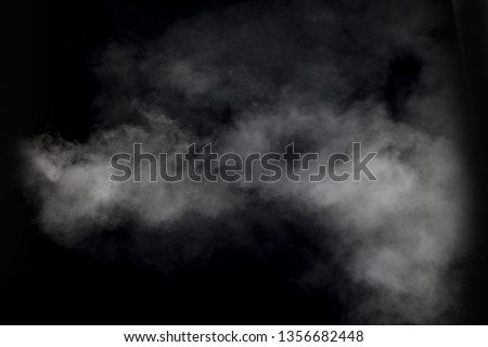 white smoke flowing on black background 