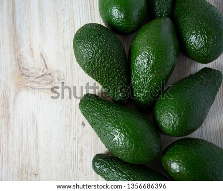 avocado on white wooden surface