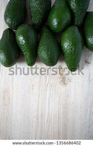 avocado on white wooden surface