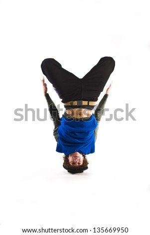 Break dancer rotating on head. Royalty-Free Stock Photo #135669950