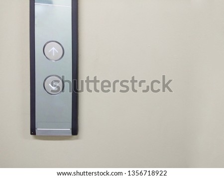 Button to select up or down on the front of the elevator