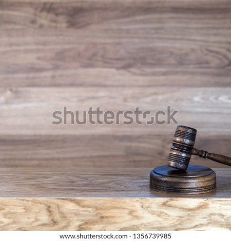 Law and justice concept image. Brown wooden background
