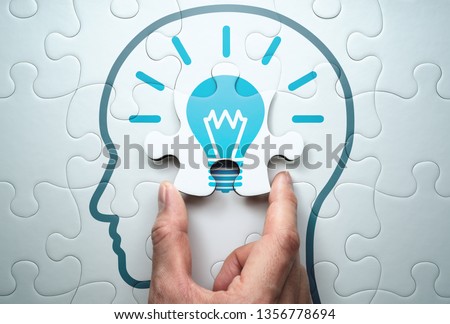 Getting knowledge and solving problem. Logical idea concept. 
Connecting last jigsaw puzzle piece. 
 Royalty-Free Stock Photo #1356778694