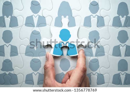Selecting person and building team. Business people relationship concept.
Connecting last jigsaw puzzle piece. 
 Royalty-Free Stock Photo #1356778769