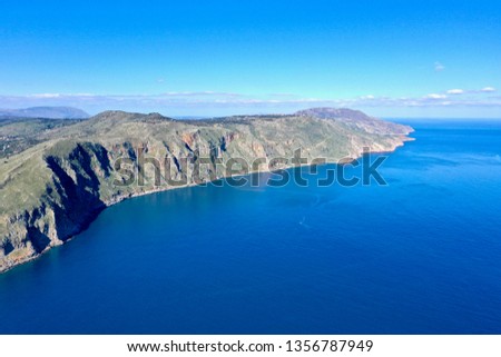 Aerial photography close to Georgioupolis, with olive groves, beaches, snowy mountains, lake kourna, the sea in a wonderful blue and green on a crispy winter day