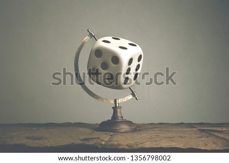 surreal concept; roll world dice for random travel destination Royalty-Free Stock Photo #1356798002