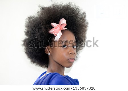 Beautiful Nigerian girl with natural afro and in a blue attire