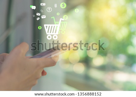 Women hand using smartphone do online selling for people shopping online with chat box, cart, dollar icons pop up. Social media maketing concept.