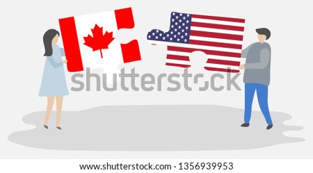 Couple holding puzzle pieces with Canadian and American flags. Canada and United States of America national symbols together.