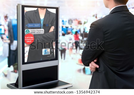 Intelligent Digital Signage , Augmented reality marketing and face recognition concept. Smart glass interactive artificial intelligence digital advertisement in fashion retail shopping Mall. 