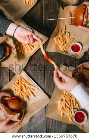 Group of friends eating at fast food