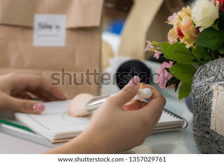 Makeup business card in the hands of a makeup artist to provide beauty services