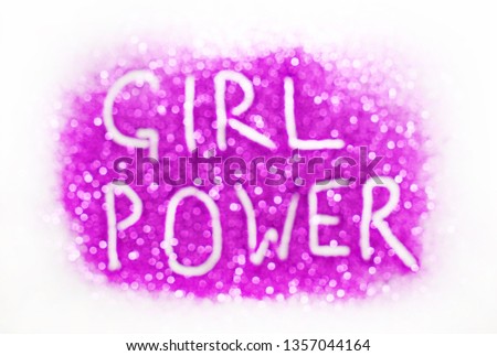 Defocused image -  pink text made from glitters -  GIRL POWER writing on white paper background with copy space. Women empowerment concept, template for female blog or girl power design