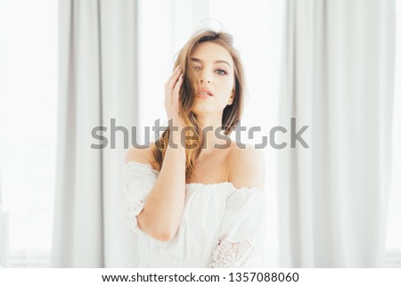 Girl at the curtains. 
The girl at the window. Gentle image of a girl.
