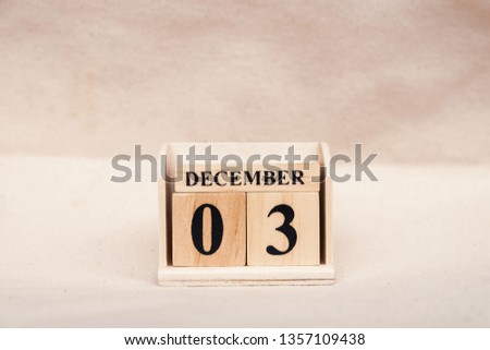December 3rd. Image of December 3 wooden color calendar on white canvas background. empty space for text