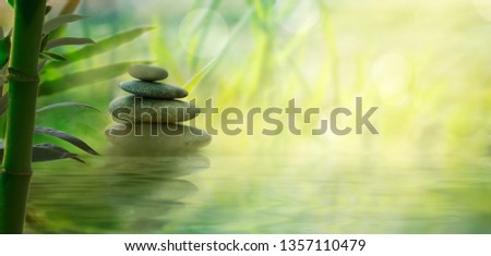 Spa and wellness. Natural massage stones  with bamboo0. Spa  oriental background Royalty-Free Stock Photo #1357110479