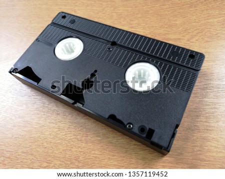 A blank VHS tape with spools