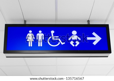 Blue public sign showing toilet and baby change room directions