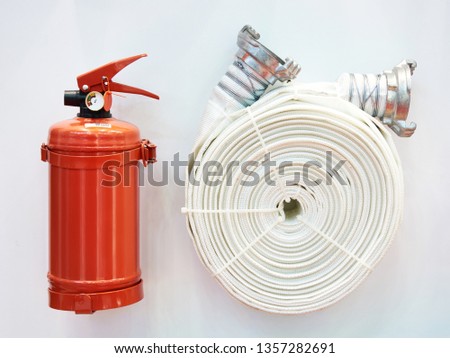 Powder fire extinguisher and fire hose on stand