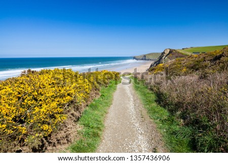 On the coast path overlooking the golden sandy beach at Watergate Bay near Newquay Cornwall England UK Europe