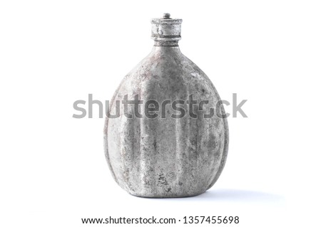 Aluminum military water bottle with a dirty lid on a white background, isolate