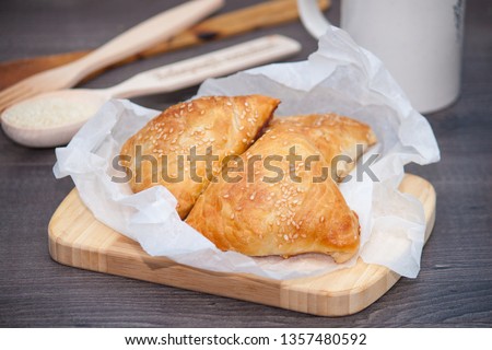 Indian, Asian food delicious samsa or samoses on wooden background. Royalty-Free Stock Photo #1357480592