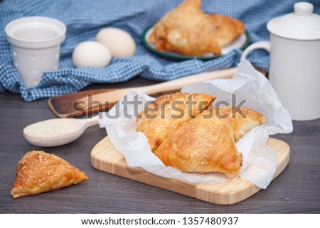 Indian, Asian food delicious samsa or samoses on wooden background. Royalty-Free Stock Photo #1357480937