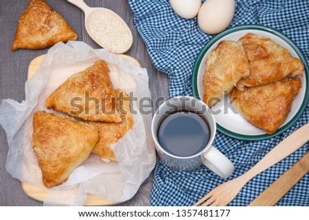 Indian, Asian food delicious samsa or samoses on wooden background. Top view, flat lay. Royalty-Free Stock Photo #1357481177
