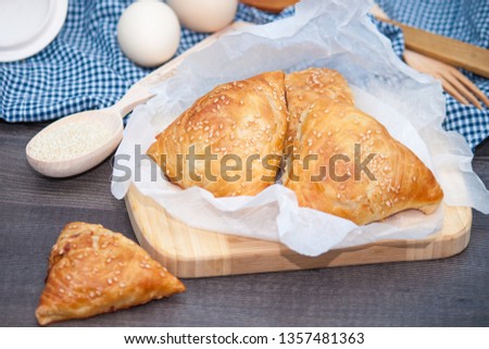 Indian, Asian food delicious samsa or samoses on wooden background. Royalty-Free Stock Photo #1357481363